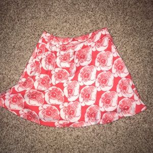 red flowing skirt with white flowers